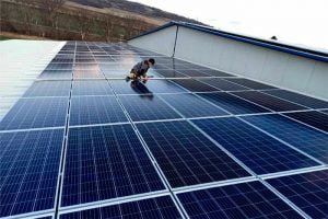 Feed-in-tariff-on-20kW-solar-system-man-works