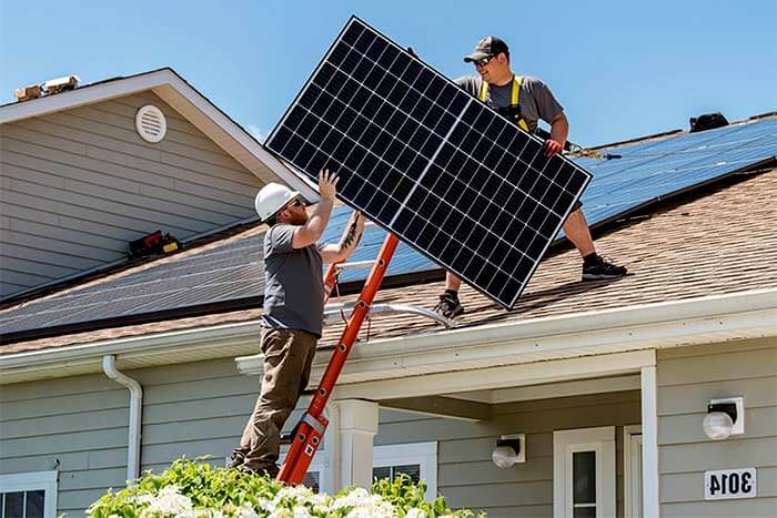 Should I replace my roof before installing solar panels two men install solar on the roof